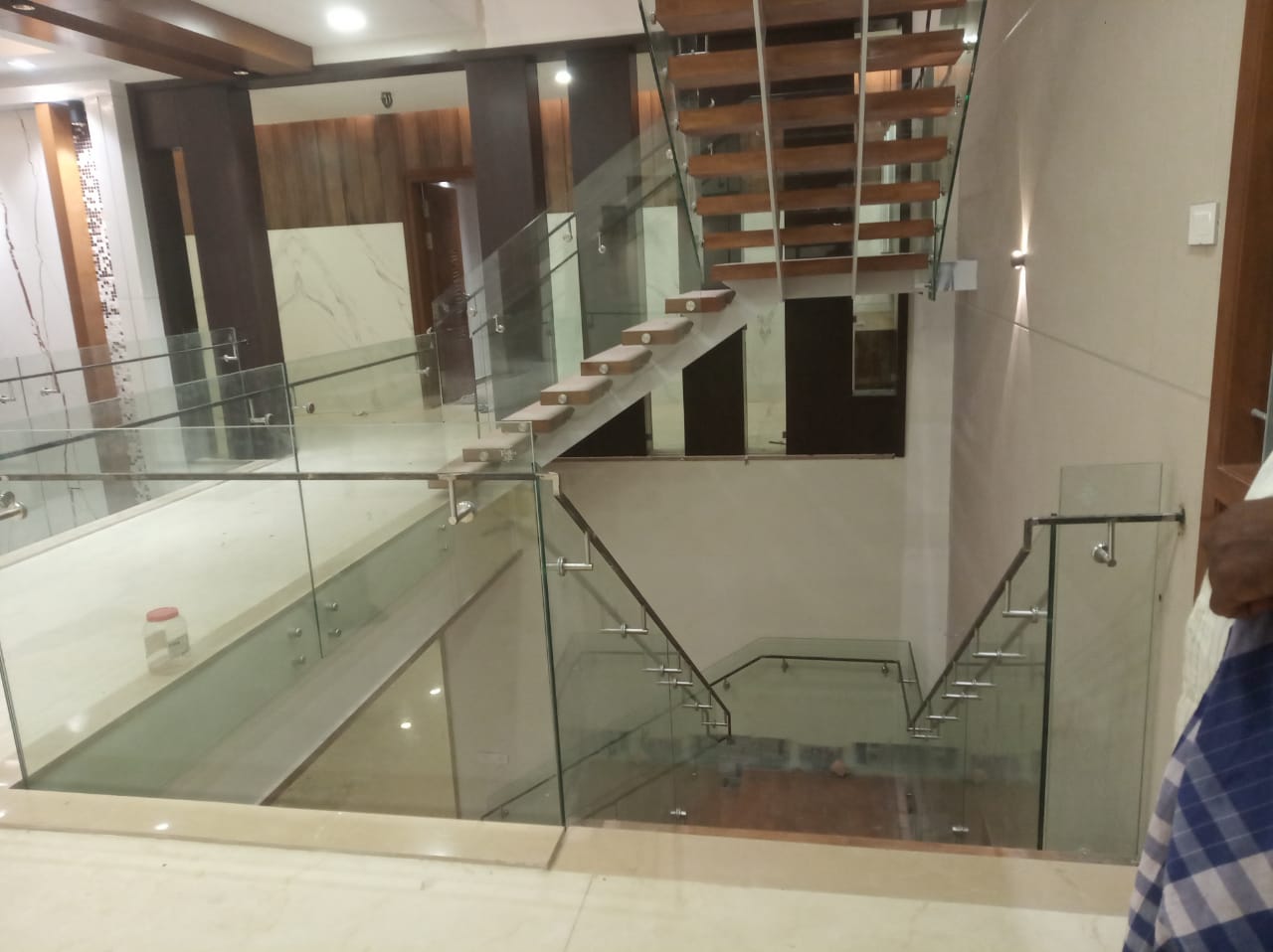 Modern floating staircase with glass railing balustrade